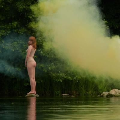 He was a curious figure. He was positioned on the opposite bank of the river.